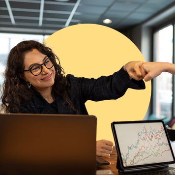 Two women giving a fist bump