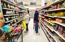 People shop in the food section of a retail store in Rosemead, California