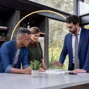people talking to a man in a suit