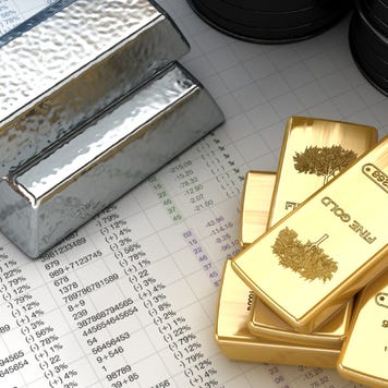 Silver, gold ingots with oil barrels on fictitious financial data