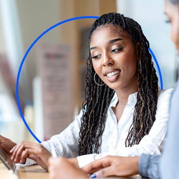 A financial advisor meeting with clients