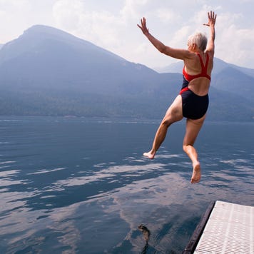 babyboomer jumping into lake