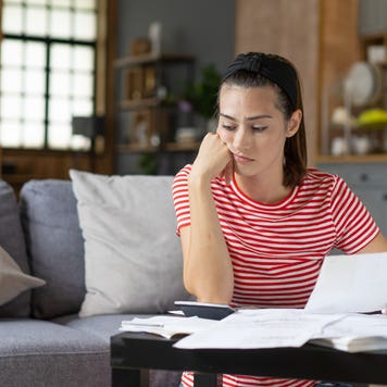 Woman contemplates finances