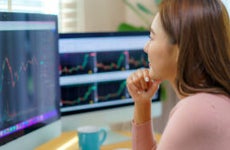 Woman Trading Stocks or Cryptocurrency at Home