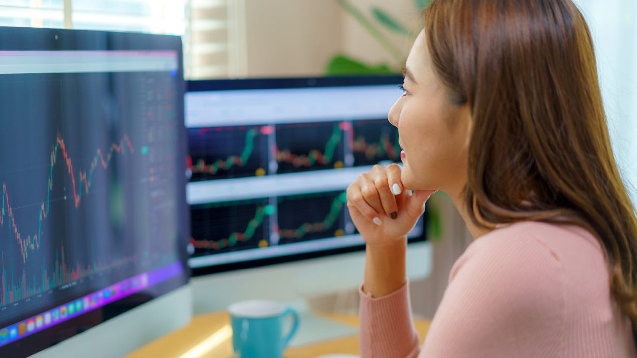 Woman Trading Stocks or Cryptocurrency at Home