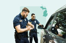 Cops writing a speeding ticket