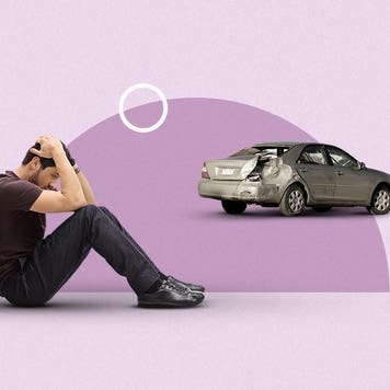 Person mourning the loss of their car.