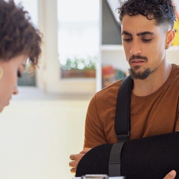 A person in a cast checking out of a hospital
