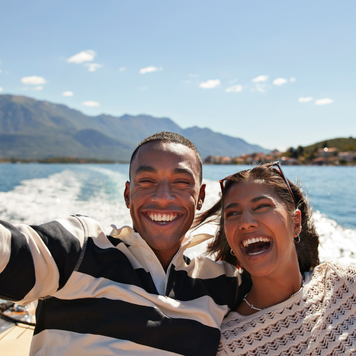 couple takes a selfie on a boat
