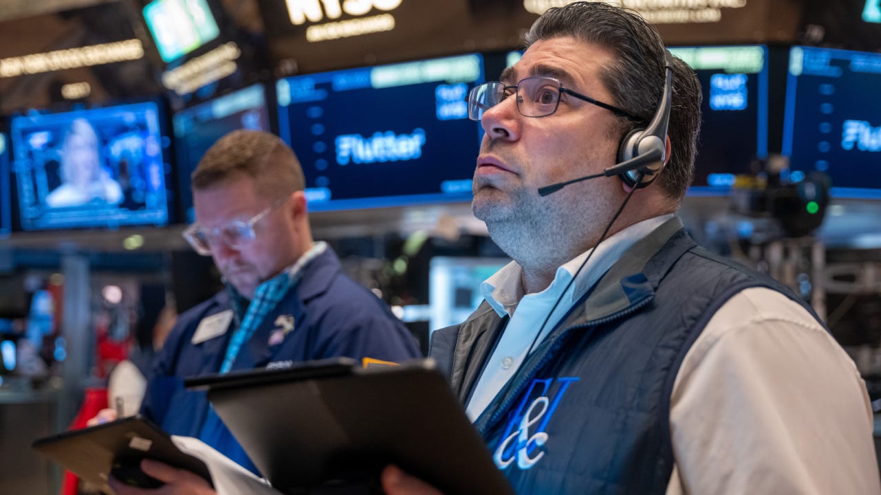 Traders work on the floor of the New York Stock Exchange