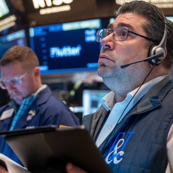 Traders work on the floor of the New York Stock Exchange