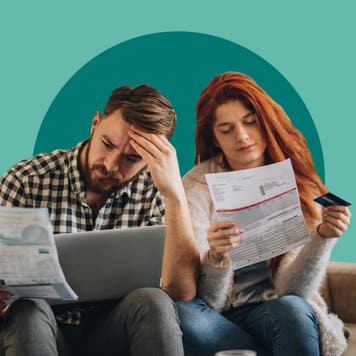 People sitting together, reviewing paperwork