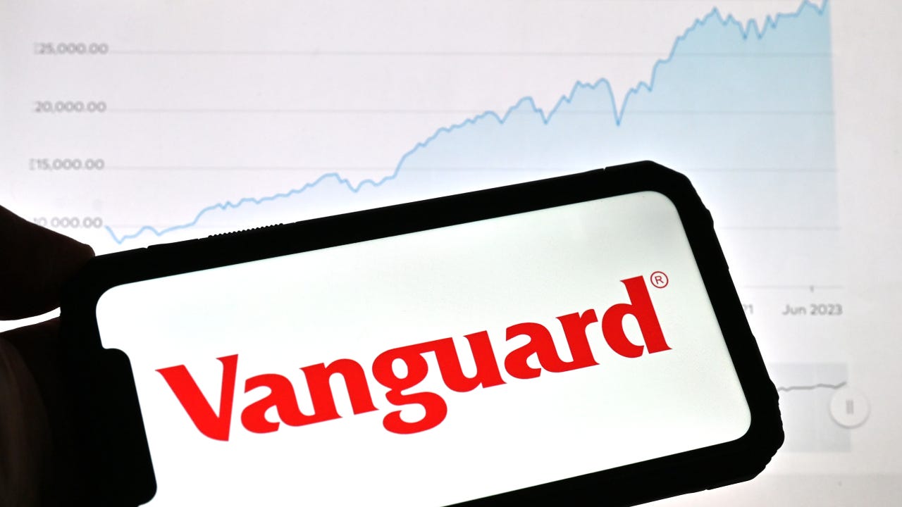 photo illustration, a Vanguard logo is displayed on a smartphone