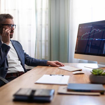 Mid adult business man working alone in his office