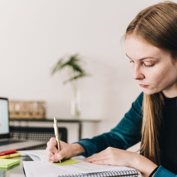 Young woman studying at home