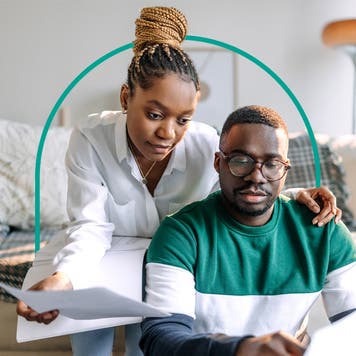 design image of a couple looking at some papers