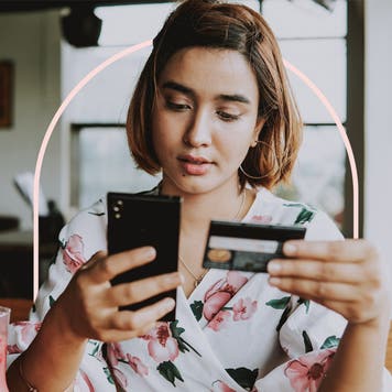 design image of a woman with credit card and phone