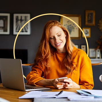 A woman looking at her phone