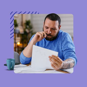A man reviewing a paper document
