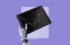 Robot arm holding a tablet with financial graphs