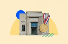 A bank building with a large gold medal hanging from it