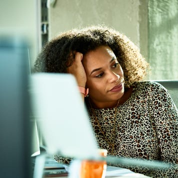 woman looking bored at desk
