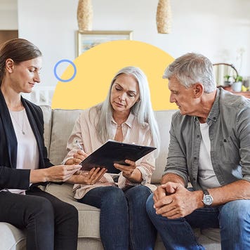 couple going over closing statement with realtor