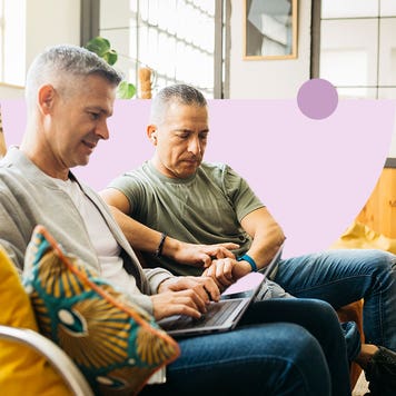 Two gay people looking at insurance options