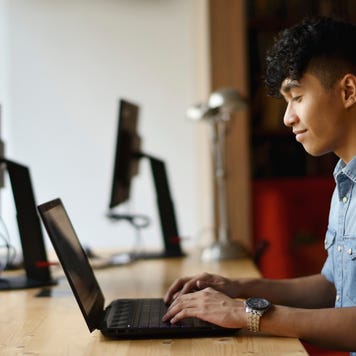 Young man working in a co-working office