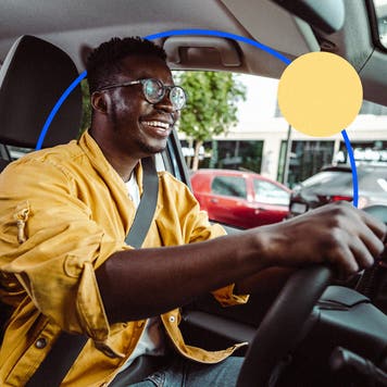 Smiling black man driving