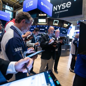 Traders work on the floor of the New York Stock Exchange