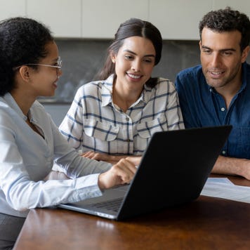 Couple talking to a financial advisor about an investment