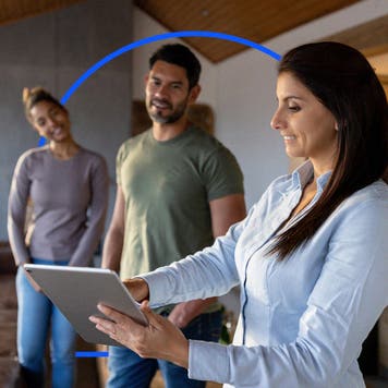 3 people reviewing a tablet