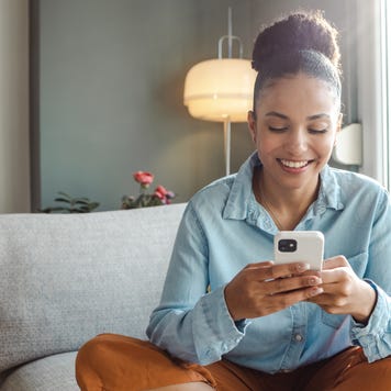 Young woman using a smart phone at home