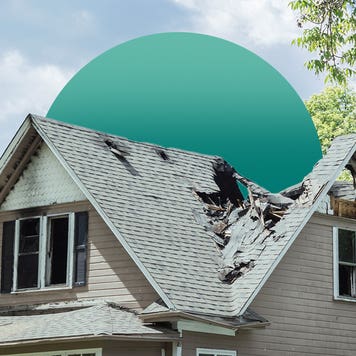 home with triangular roof and trees in background