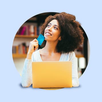 design image of a young women on her laptop holding a credit card in her hand