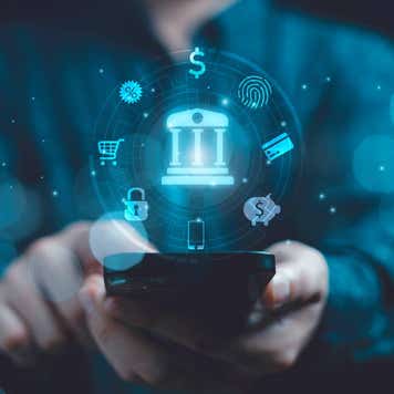 Business using smartphone with banking icon