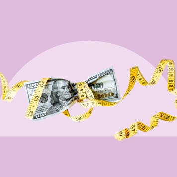 measuring the waistline of cash bills, comical