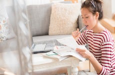 Woman paying bills on laptop