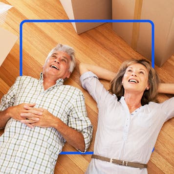 A couple laying om a hardwood floor