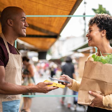 A shop owner talking with a customer