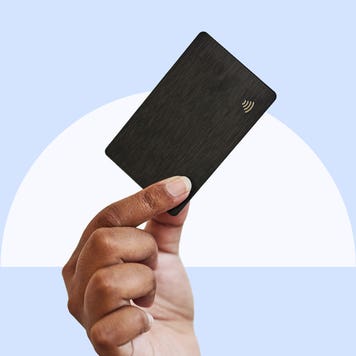 Design element of a hand holding a credit card in the air