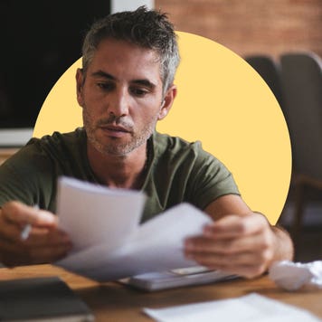 A man looks at paperwork