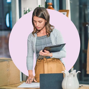 A business person holding a tablet.