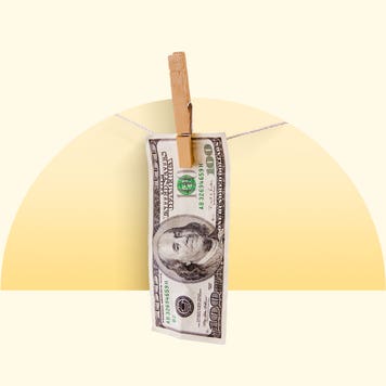 A 100 dollar bill hanging on a closeline