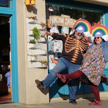 Rosalie and Douglas Gale standing in front of the Ugly Baby shop
