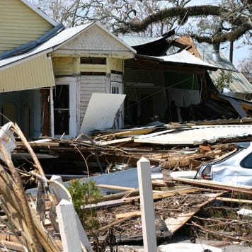 home with surrounding hurricane damage