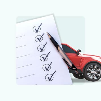 A checklist and a car peaking out from behind the list