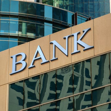 Bank sign on glass wall of business center