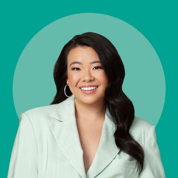 Personal finance influencer Vivian Tu wearing a light green suit